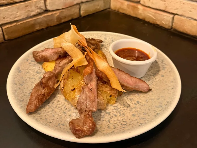Grilled Iberian pork with wrinkled potatoes and spicy mojo sauce